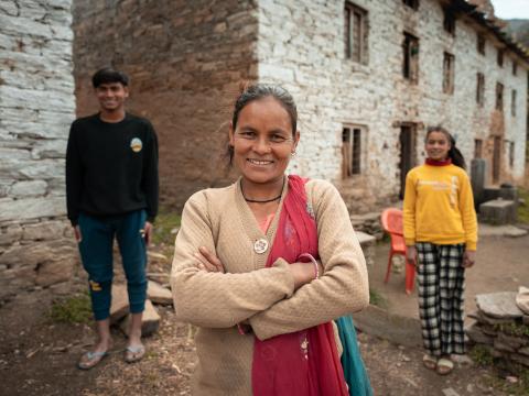 Amrita stands with her children